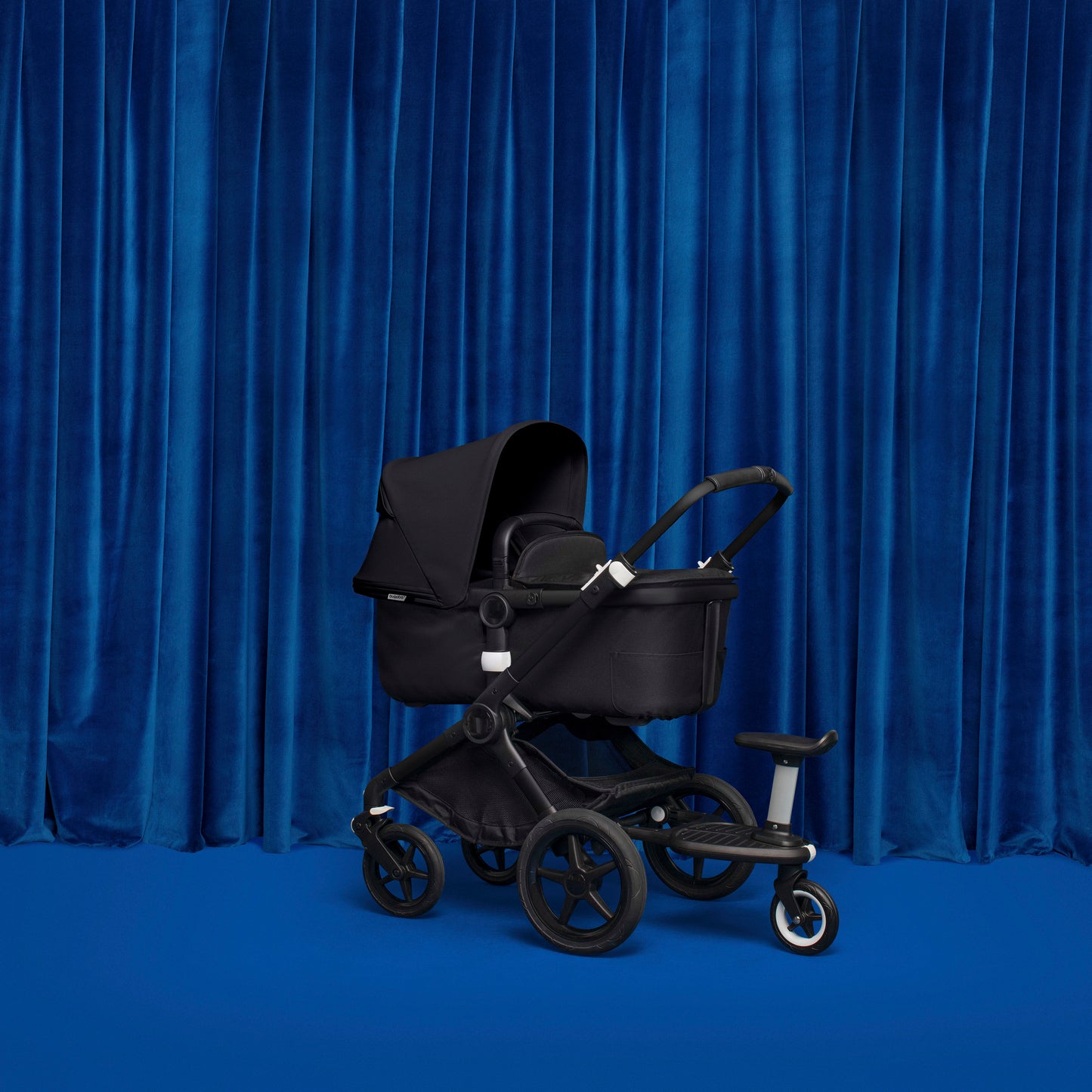 Bugaboo wheeled board, allowing both sitting and standing positions on a pram.