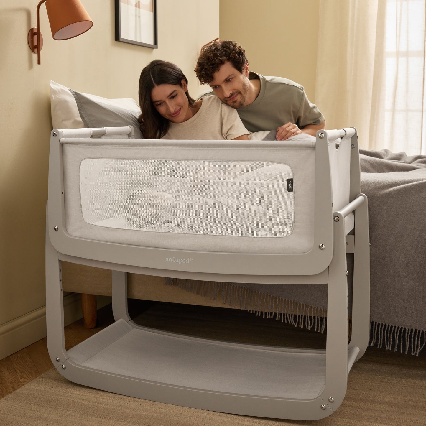 A Pebble Snuzpod5 bedside crib designed for infants, showcasing a modern and safe sleeping environment.