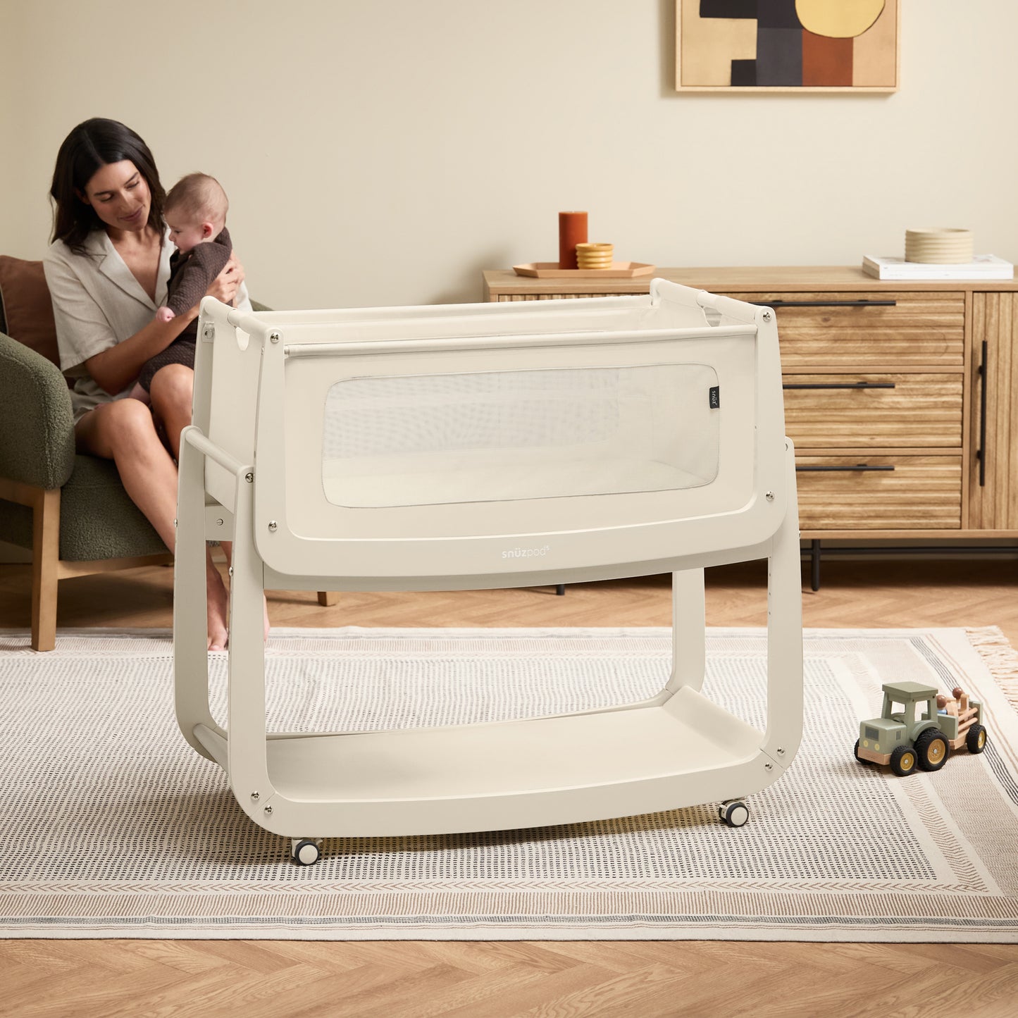 A Cashmere Snuzpod5 bedside crib designed for infants, showcasing a modern and safe sleeping environment.