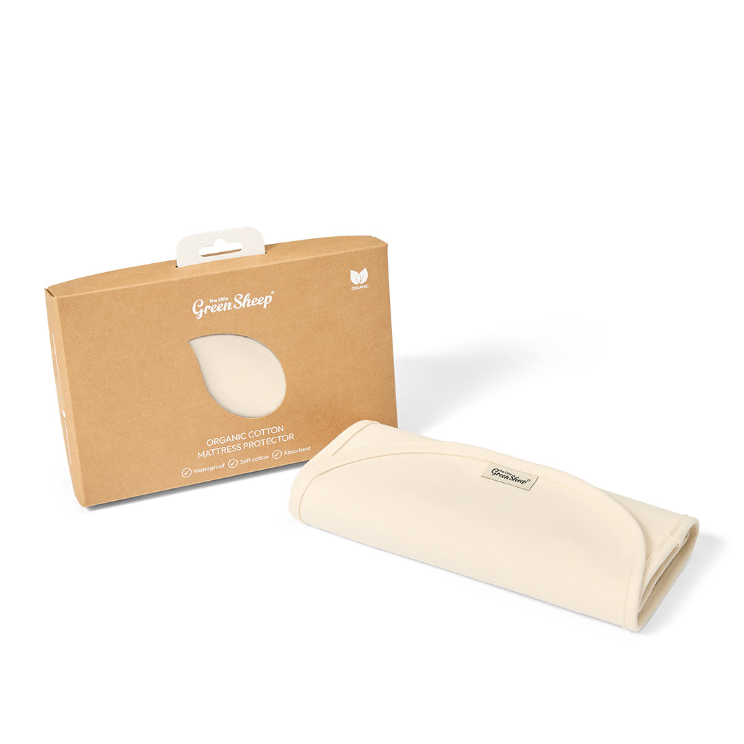 Little green sheep organic mattress protector for moses basket of pram, in a natural beige colour.