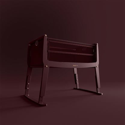 SnuzPod Studio bedside crib in Rome Burgundy colour.