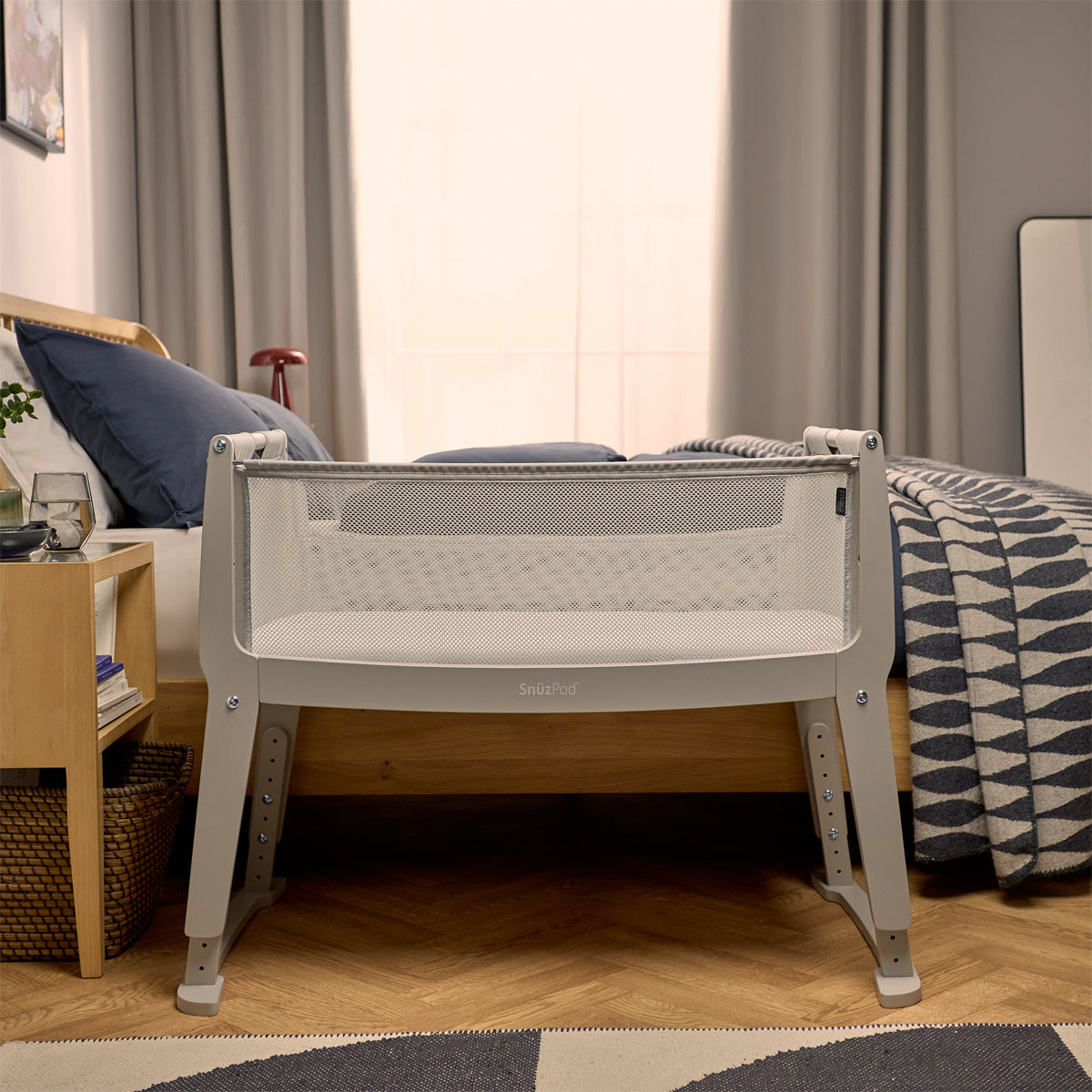 SnuzPod Studio bedside crib in Oslo Light Grey colour.