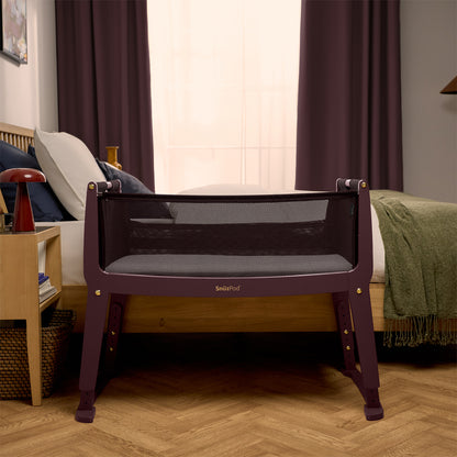 SnuzPod Studio bedside crib in Rome Burgundy colour.