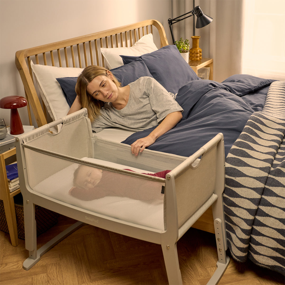 SnuzPod Studio bedside crib in Oslo Light Grey colour.