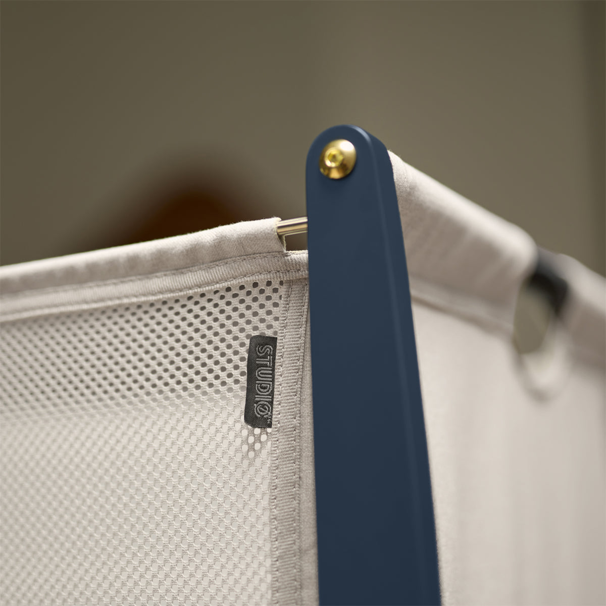 SnuzPod Studio bedside crib in London Navy colour.