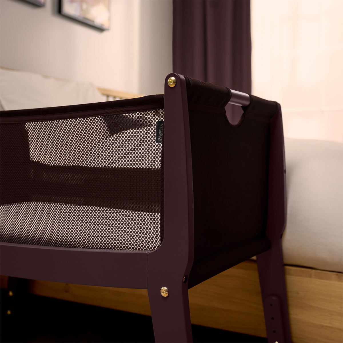 SnuzPod Studio bedside crib in Rome Burgundy colour.