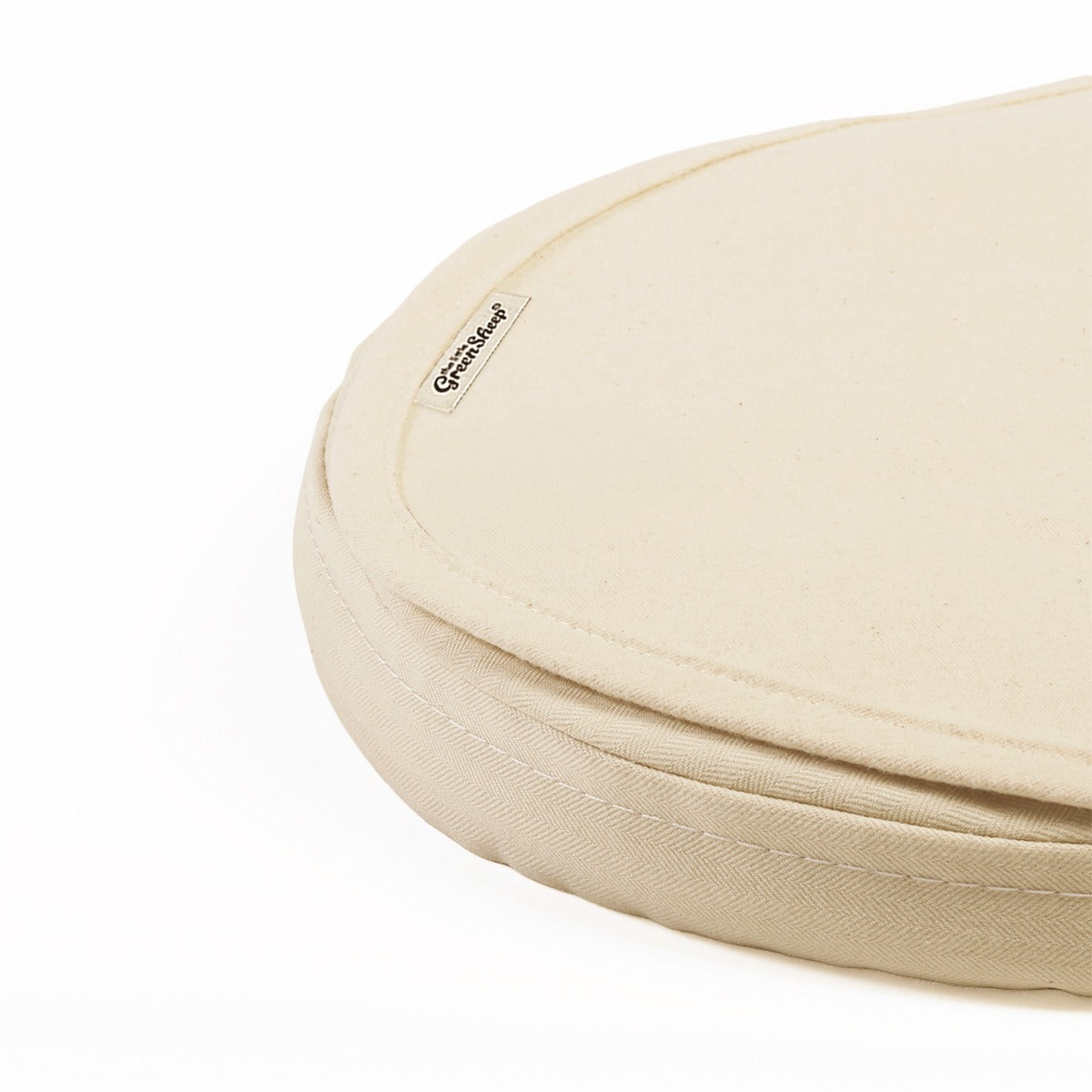 Little green sheep organic mattress protector for moses basket of pram, in a natural beige colour.