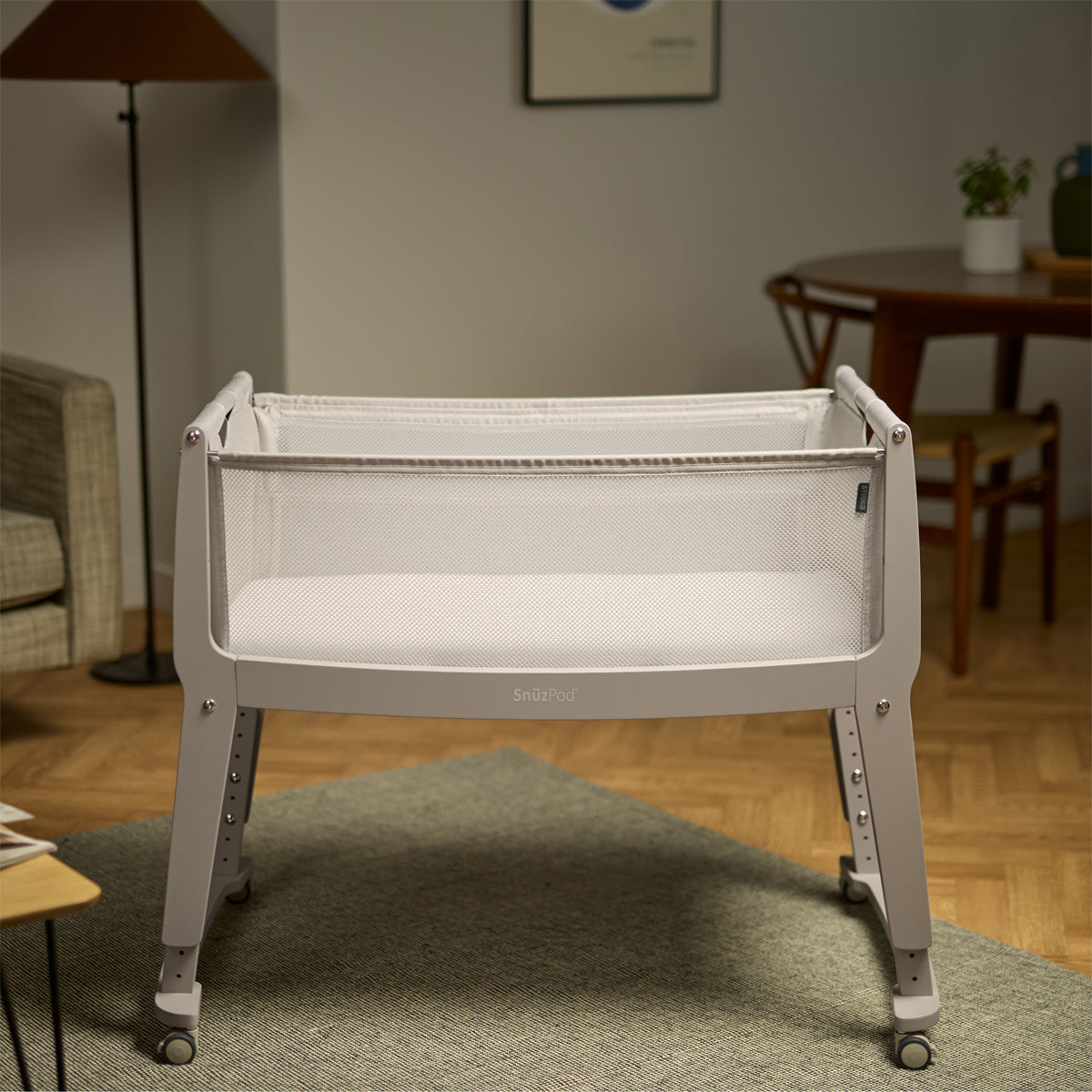 SnuzPod Studio bedside crib in Oslo Light Grey colour.