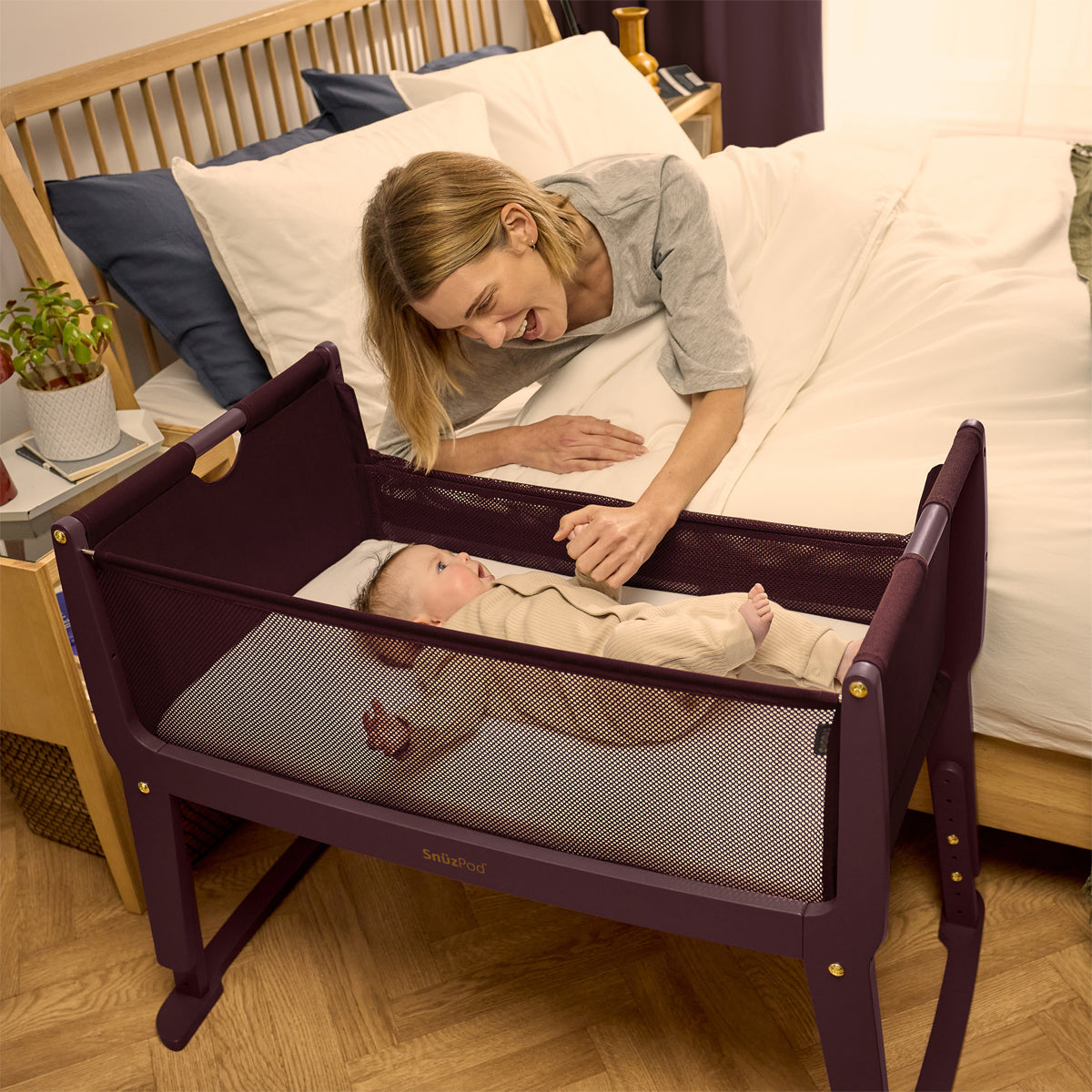 SnuzPod Studio bedside crib in Rome Burgundy colour.