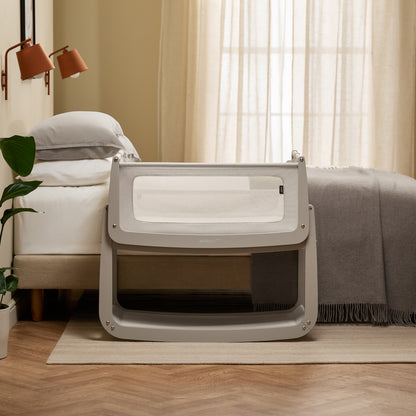 A Pebble Snuzpod5 bedside crib designed for infants, showcasing a modern and safe sleeping environment.