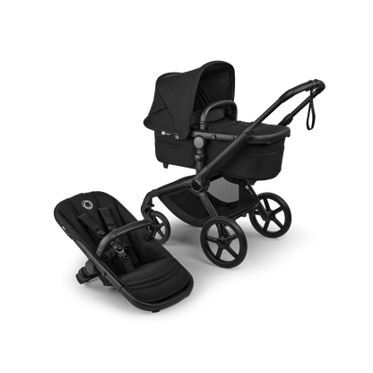 The Heritage Black Bugaboo Fox5 pushchair, equipped with a seat and carrycot fabric, offers a compact fold for all-terrain use.