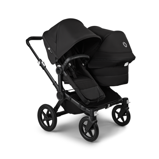 Midnight Black Bugaboo Donkey 5 stroller with 2 x seat and1 x carrycot fabrics, designed for easy folding and adaptable for mono, duo or twin configurations.