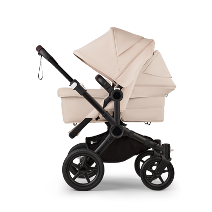 Desert Taupe Bugaboo Donkey 5 stroller with 2 x seat and1 x carrycot fabrics, designed for easy folding and adaptable for mono, duo or twin configurations.