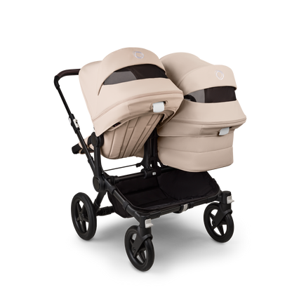 Desert Taupe Bugaboo Donkey 5 stroller with 2 x seat and 2 x carrycot fabrics, designed for easy folding and adaptable for mono, duo or twin configurations.