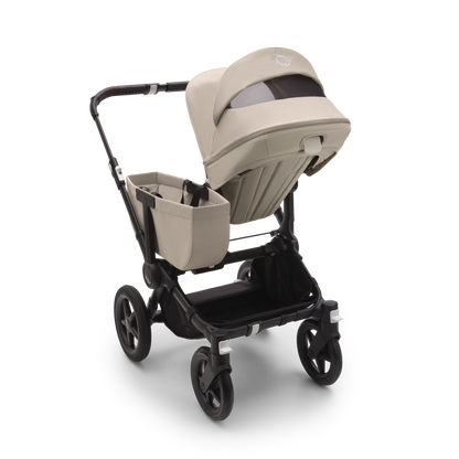 Desert Taupe Bugaboo Donkey 5 stroller with seat and carrycot fabrics, designed for easy folding and adaptable for duo or twin configurations.