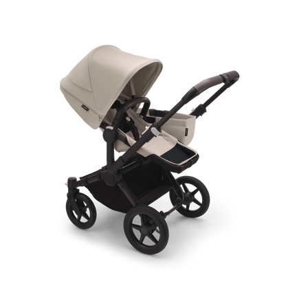 Desert Taupe Bugaboo Donkey 5 stroller with seat and carrycot fabrics, designed for easy folding and adaptable for duo or twin configurations.