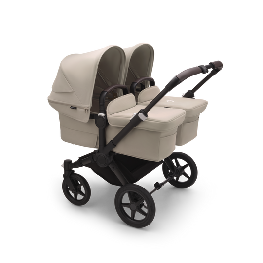 Desert Taupe Bugaboo Donkey 5 stroller with 2 x seat and 2 x carrycot fabrics, designed for easy folding and adaptable for mono, duo or twin configurations.