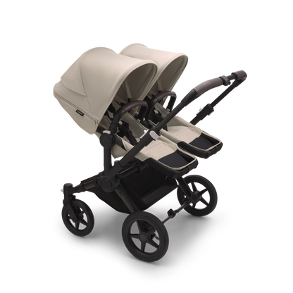 Desert Taupe Bugaboo Donkey 5 stroller with 2 x seat and 2 x carrycot fabrics, designed for easy folding and adaptable for mono, duo or twin configurations.