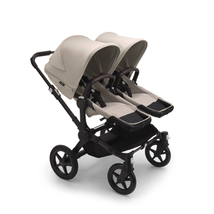 Desert Taupe Bugaboo Donkey 5 stroller with 2 x seat and 2 x carrycot fabrics, designed for easy folding and adaptable for mono, duo or twin configurations.