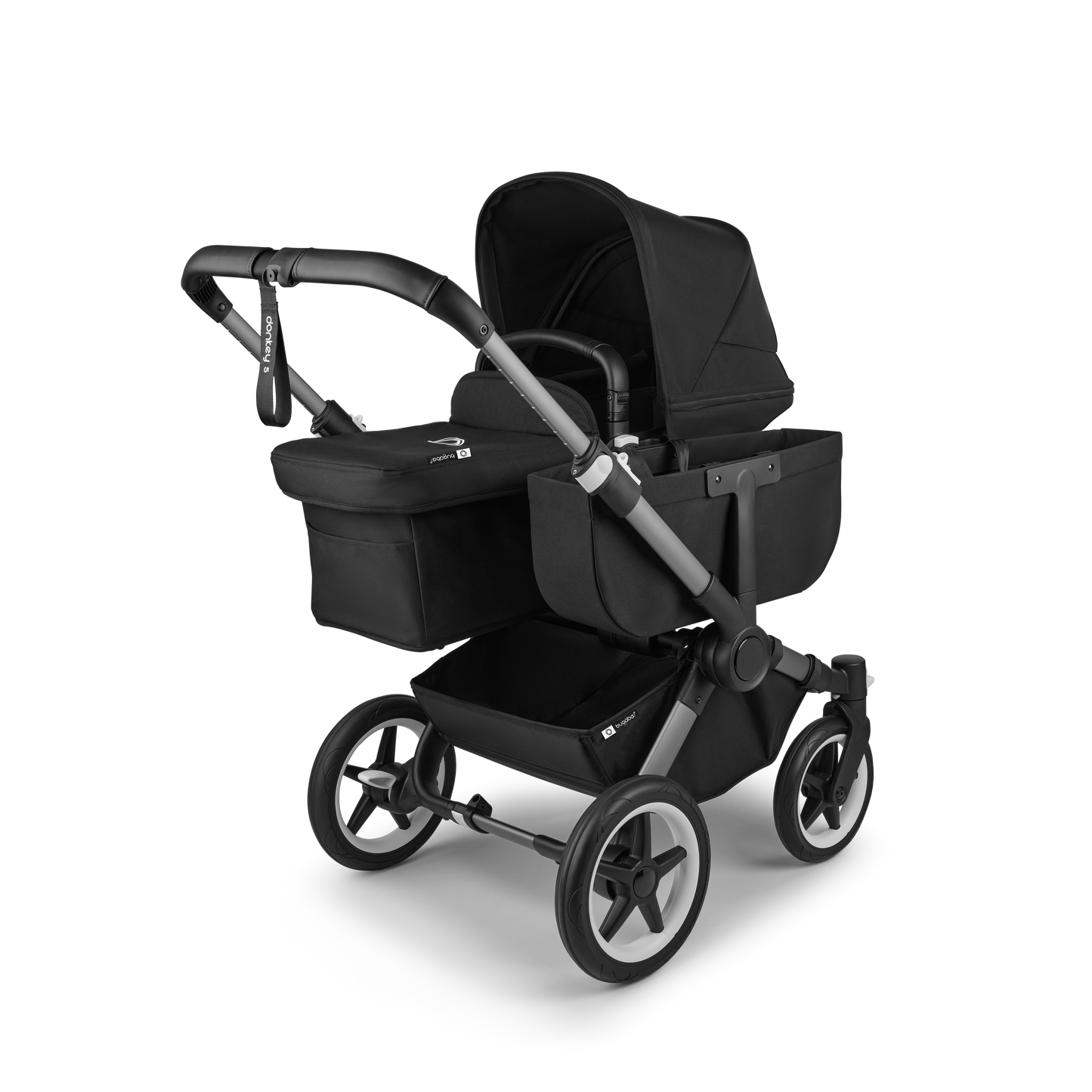 Midnight Black Bugaboo Donkey 5 stroller with seat and carrycot fabrics, designed for easy folding and adaptable for duo or twin configurations.