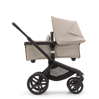 Bugaboo Fox5 stroller in Taupe Complete, equipped with a carrycot, compact fold, and suitable for all terrains.