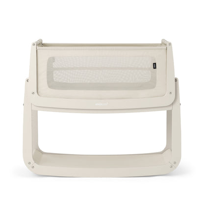 A Cashmere Snuzpod5 bedside crib designed for infants, showcasing a modern and safe sleeping environment.