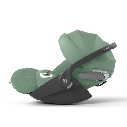 Cybex Cloud T car seat in leaf green, highlighting contemporary safety features.