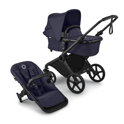 Bugaboo Cub stroller and carrycot in deep indigo blue with black chassis.