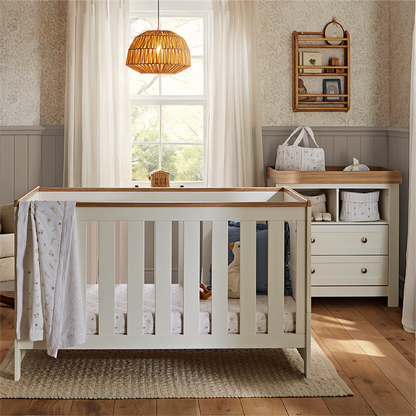 CuddleCo Burford 2 piece nursery furniture set in white with oak trim. 