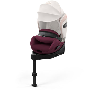 Cybex anoris Si car seat with airbag in quartz pink style colour, with isofix base attatched.