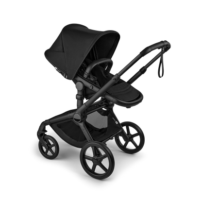 The Heritage Black Bugaboo Fox5 pushchair, equipped with a seat and carrycot fabric, offers a compact fold for all-terrain use.