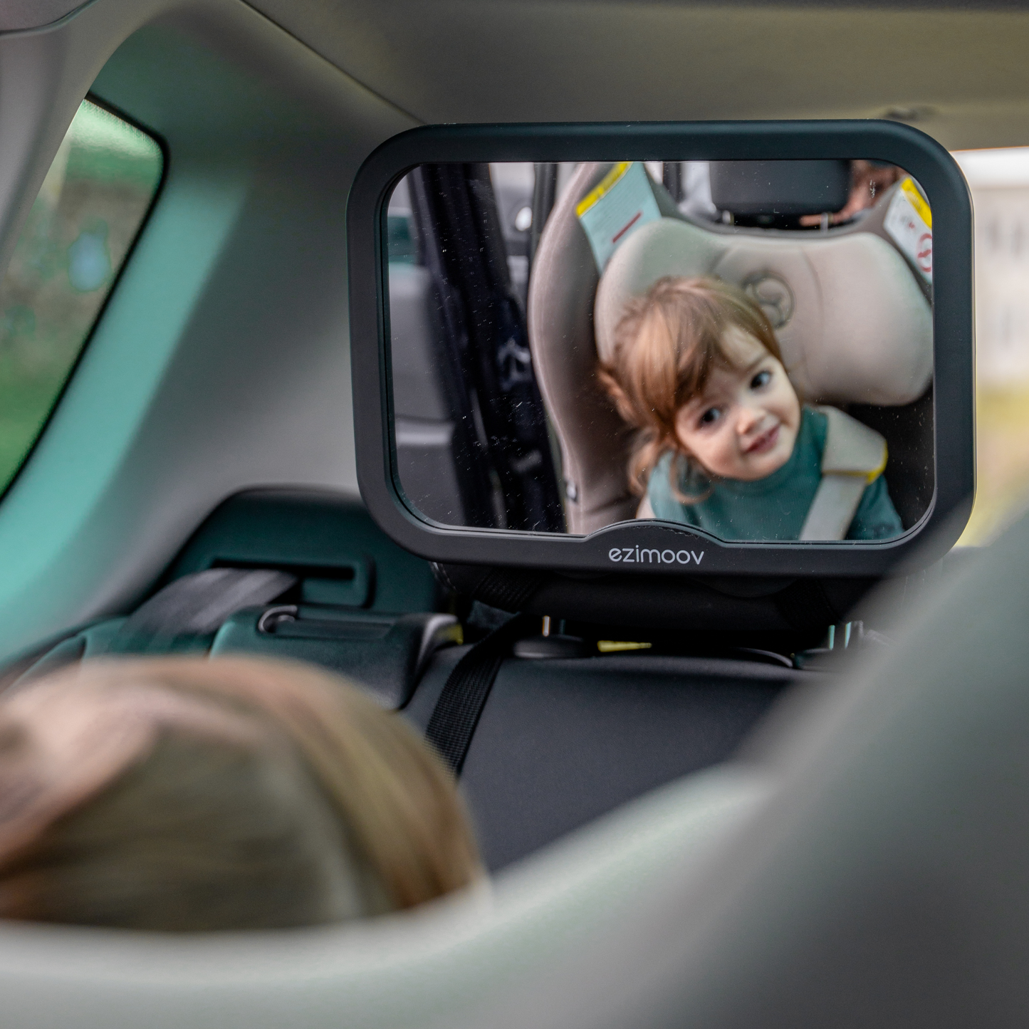 Square rearview mirror that attaches easily to a vehicle.