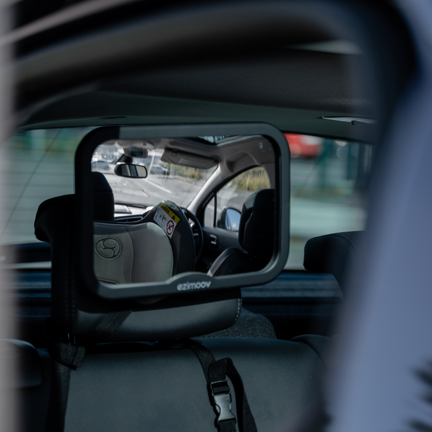 Square rearview mirror that attaches easily to a vehicle.