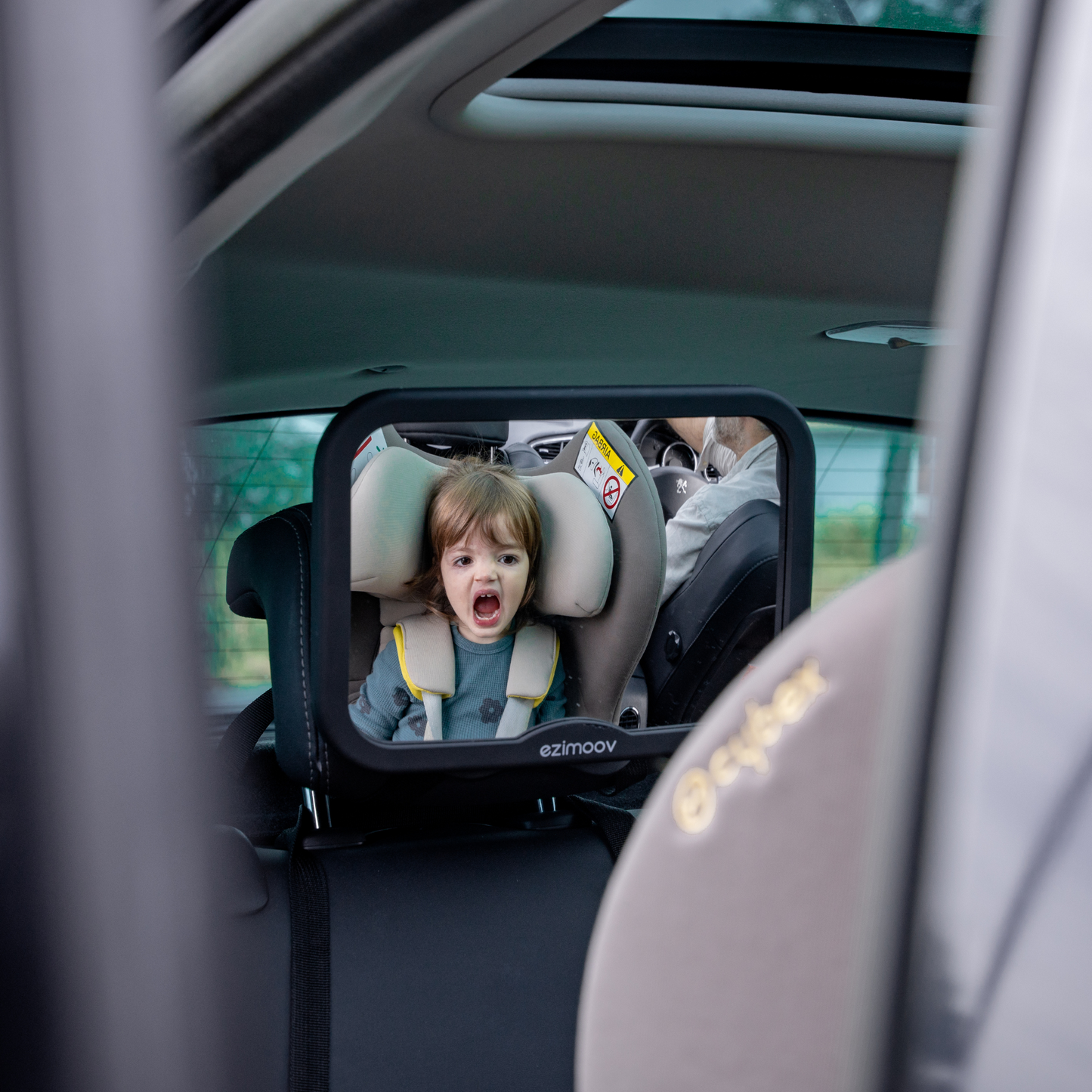 Square rearview mirror that attaches easily to a vehicle.