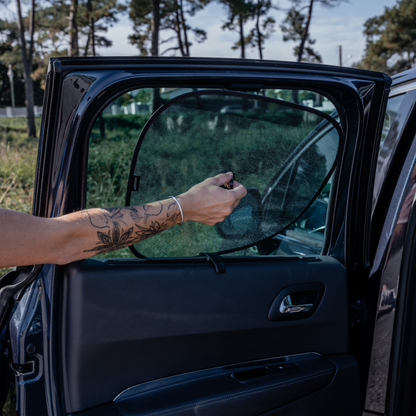 Two side window shields for sun protection, designed for easy installation.