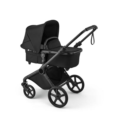 Bugaboo Cub stroller and carrycot in heritage black with black chassis.
