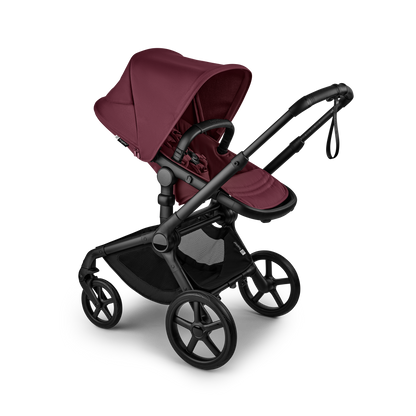 The dark cherry Bugaboo Fox5 pushchair, equipped with a seat and carrycot fabric, offers a compact fold for all-terrain use.