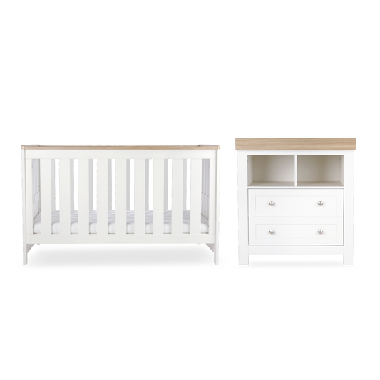 CuddleCo Burford 2 piece nursery furniture set in white with oak trim. Mattress not included.