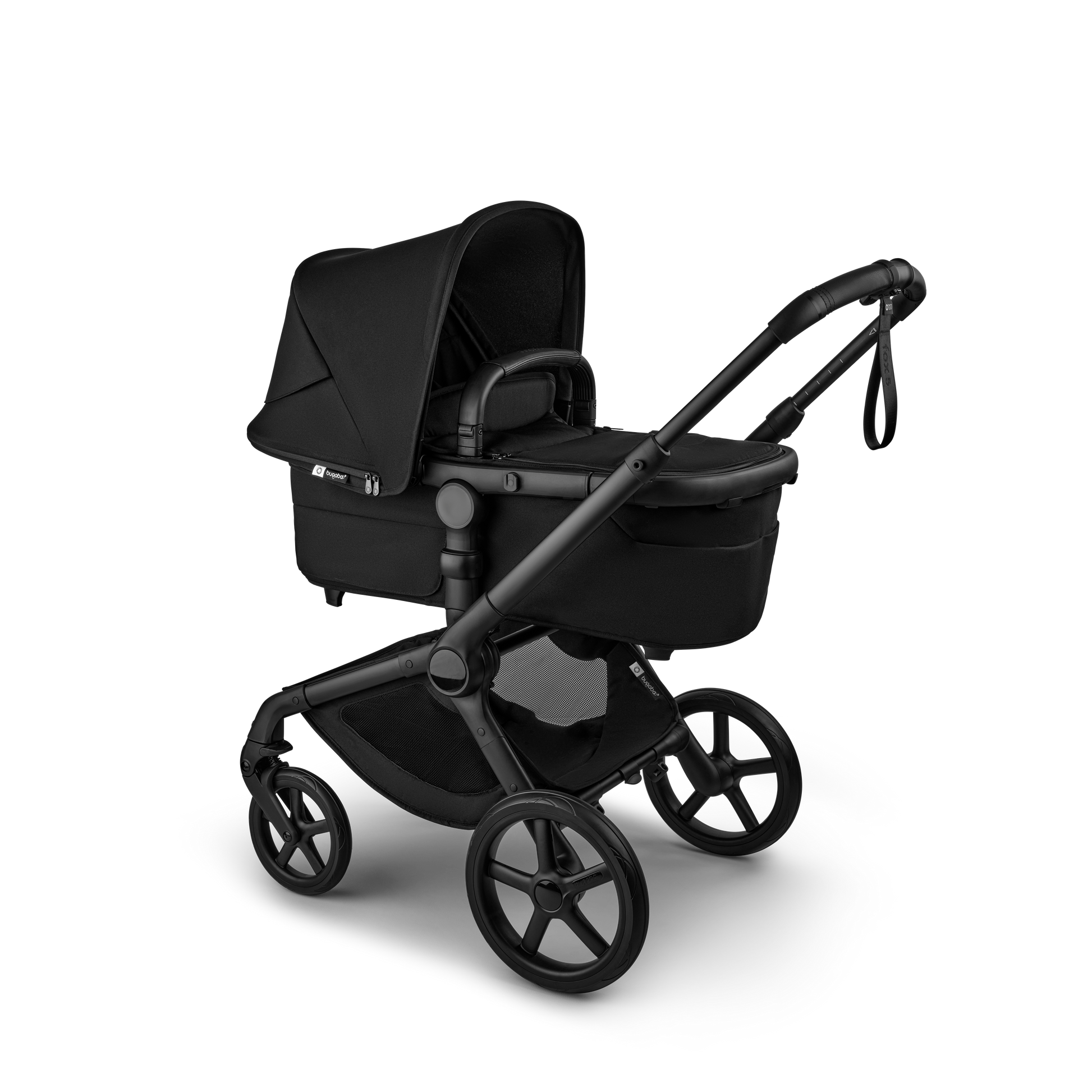 The Heritage Black Bugaboo Fox5 pushchair, equipped with a seat and carrycot fabric, offers a compact fold for all-terrain use.