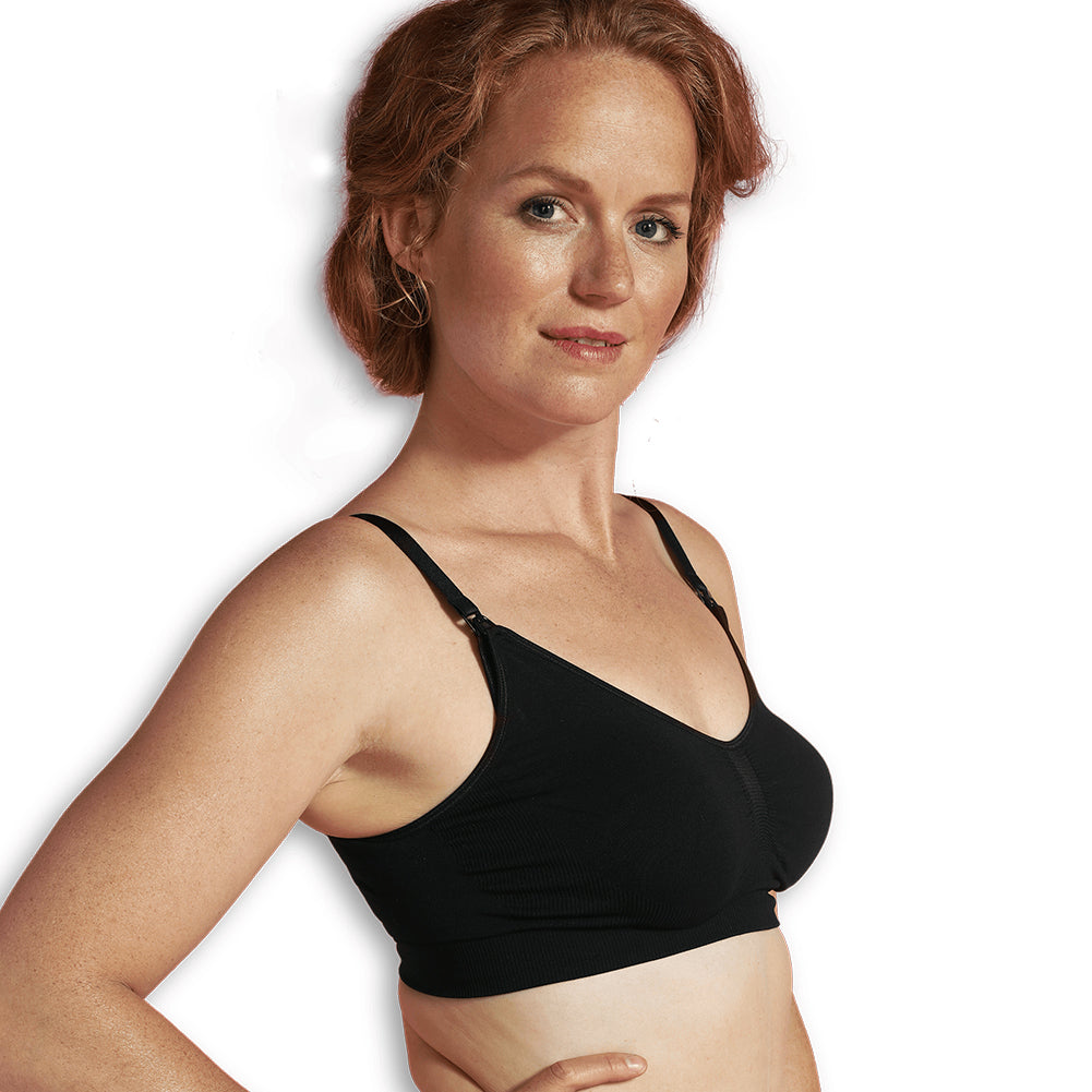 A seamless white maternity and nursing bra top with extenders for maximum skin-to-skin contact.