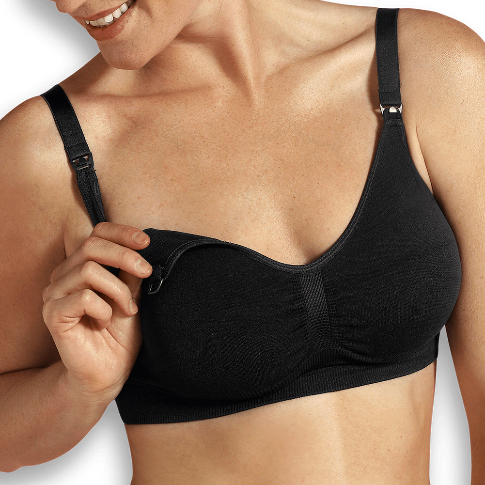 A seamless white maternity and nursing bra top with extenders for maximum skin-to-skin contact.