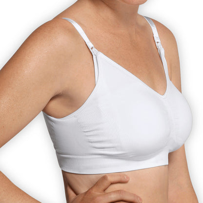 A seamless white maternity and nursing bra top with extenders for maximum skin-to-skin contact.