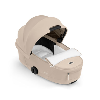 Cybex Coya Pushchair and carrycot in cozy beige colourway on a matt black chassis.