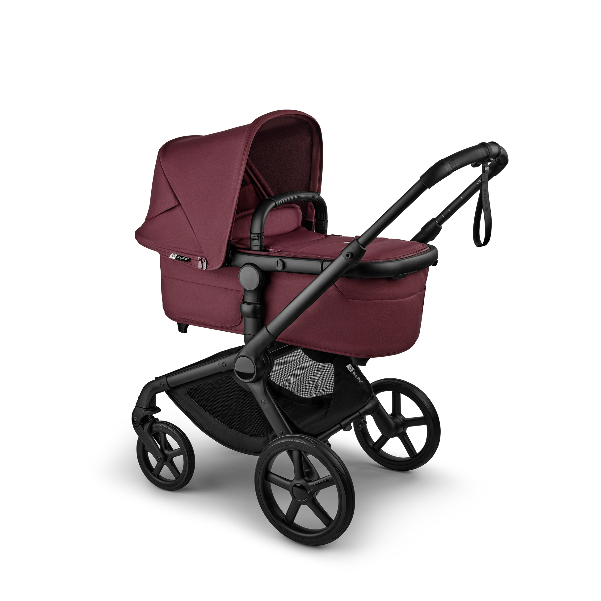 The dark cherry Bugaboo Fox5 pushchair, equipped with a seat and carrycot fabric, offers a compact fold for all-terrain use.