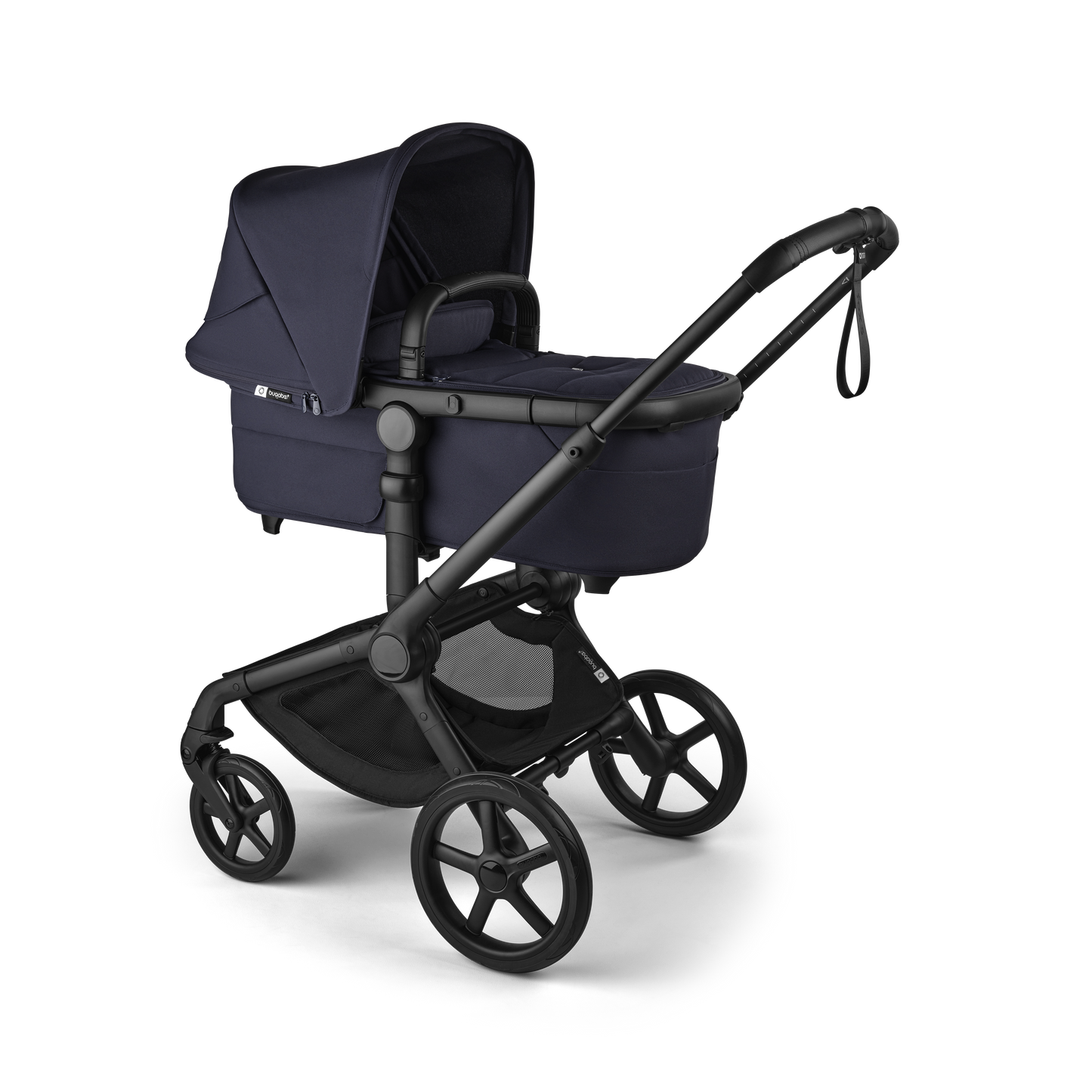 The deep indigo Bugaboo Fox5 pushchair, equipped with a seat and carrycot fabric, offers a compact fold for all-terrain use.