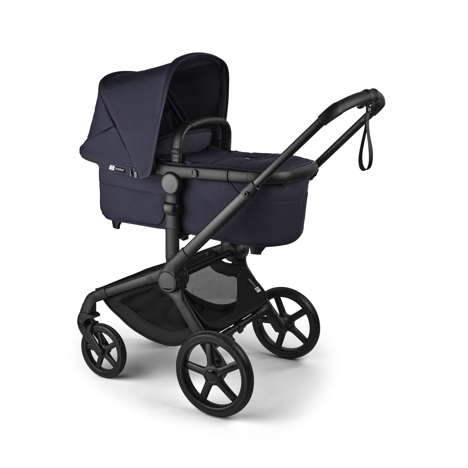 The deep indigo Bugaboo Fox5 pushchair, equipped with a seat and carrycot fabric, offers a compact fold for all-terrain use.