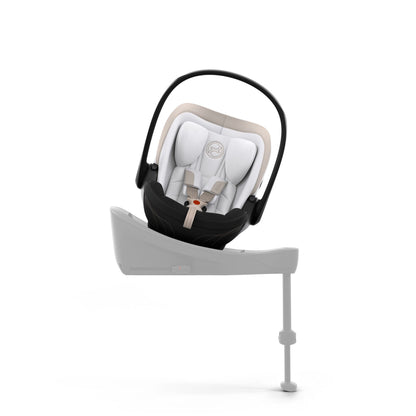 Cybex cloud s car seat in off white colour, with recline function.
