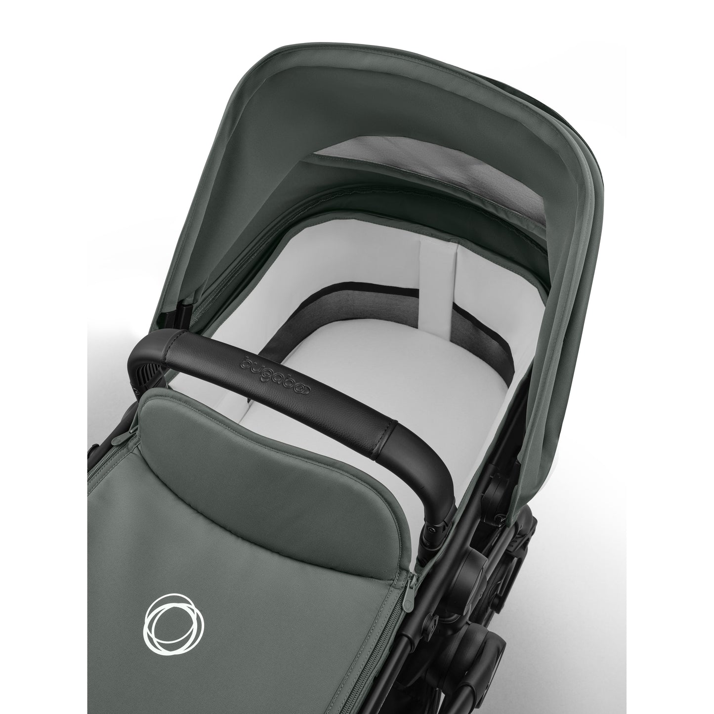 Bugaboo Cub stroller and carrycot in forest green with black chassis.