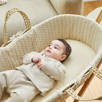 Child sleeping on Linen moses basket sheets