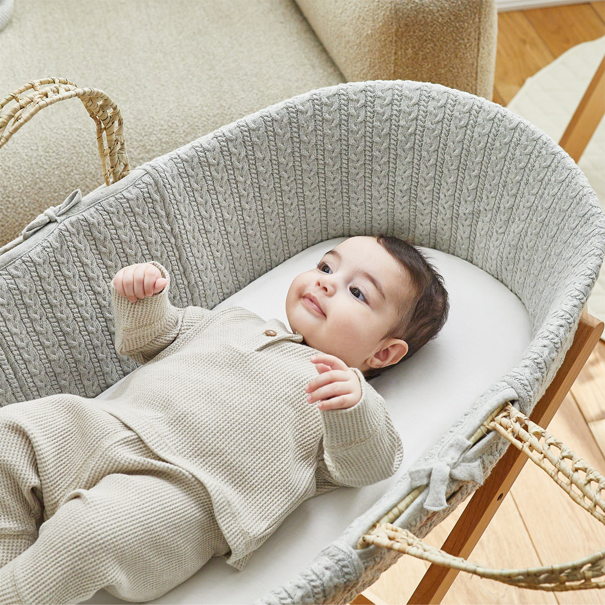 Child sleeping on Dove moses basket sheets